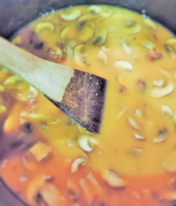 Stirring pumpkin soup